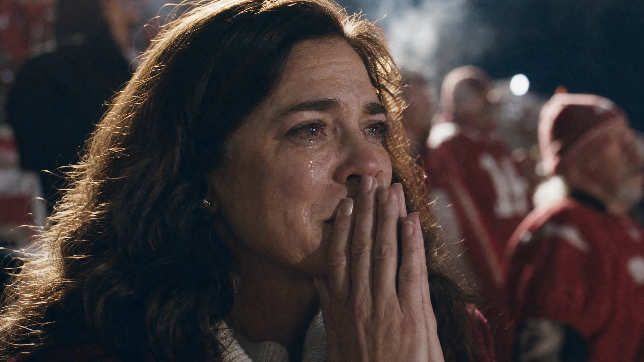 A mother in the stadium stands